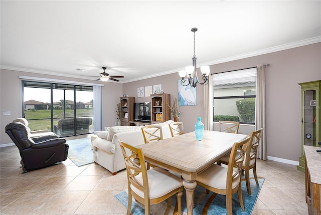 dining area featuring ceiling fan with notable chandelier, light tile patterned flooring, and ornamental molding