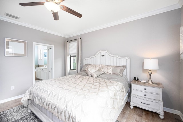 bedroom featuring ceiling fan, ornamental molding, connected bathroom, and light hardwood / wood-style flooring