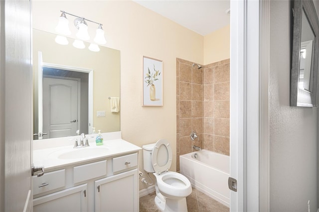 full bathroom featuring tile patterned floors, toilet, vanity, and tiled shower / bath