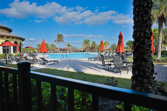 view of swimming pool with a patio