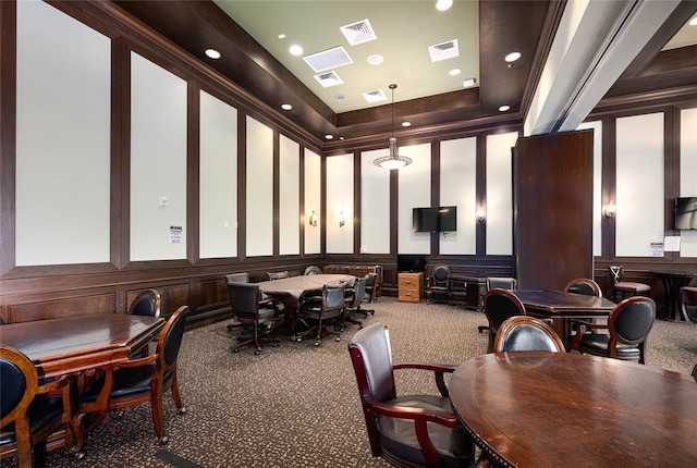 dining space featuring a raised ceiling and carpet floors