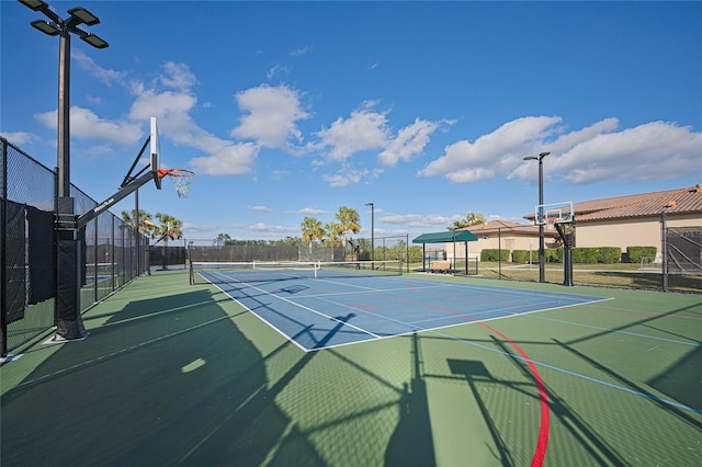 view of sport court with basketball hoop