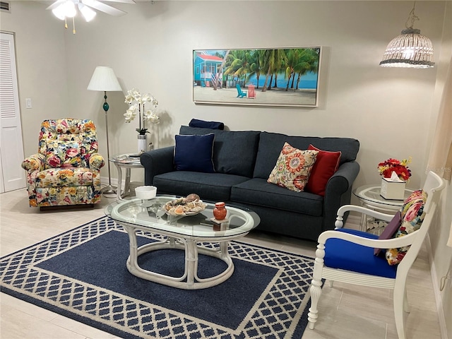 living room featuring hardwood / wood-style flooring and ceiling fan