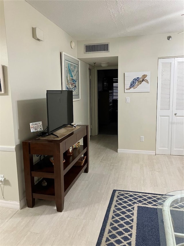 living room with a textured ceiling