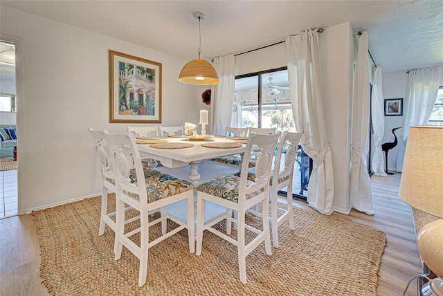 dining area featuring light wood-type flooring