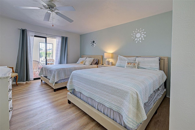 bedroom featuring light hardwood / wood-style flooring and ceiling fan