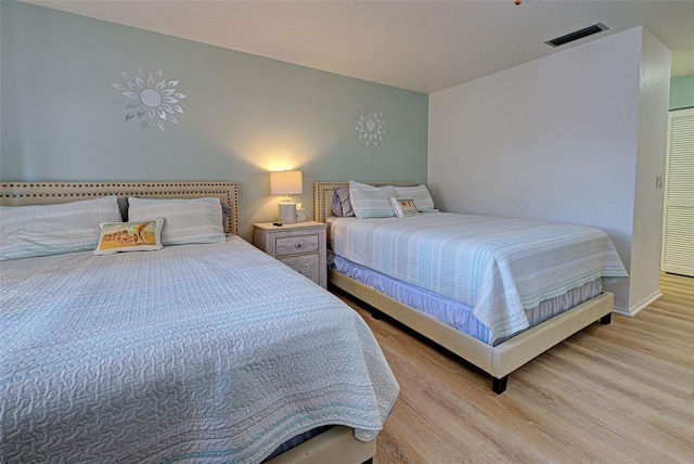 bedroom featuring light hardwood / wood-style floors