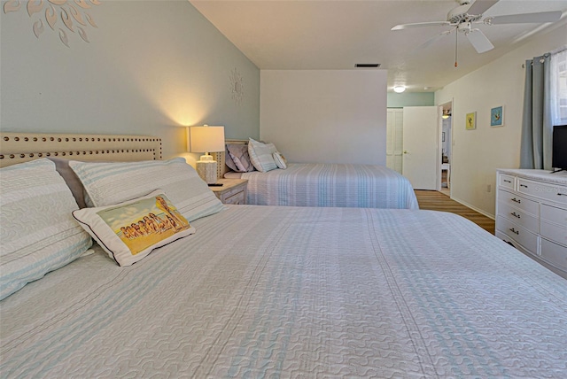 bedroom featuring hardwood / wood-style flooring and ceiling fan