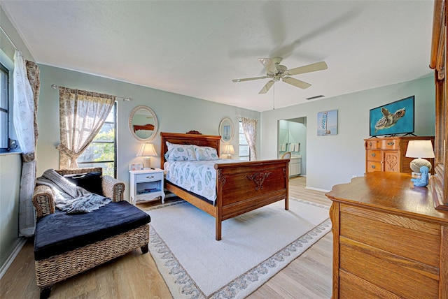 bedroom with ceiling fan and light hardwood / wood-style floors