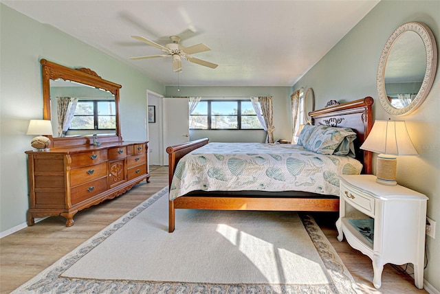 bedroom featuring ceiling fan and light wood-type flooring