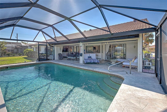 view of swimming pool with a lanai and a patio area