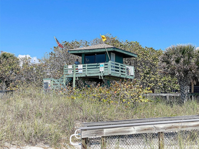 rear view of property with a wooden deck