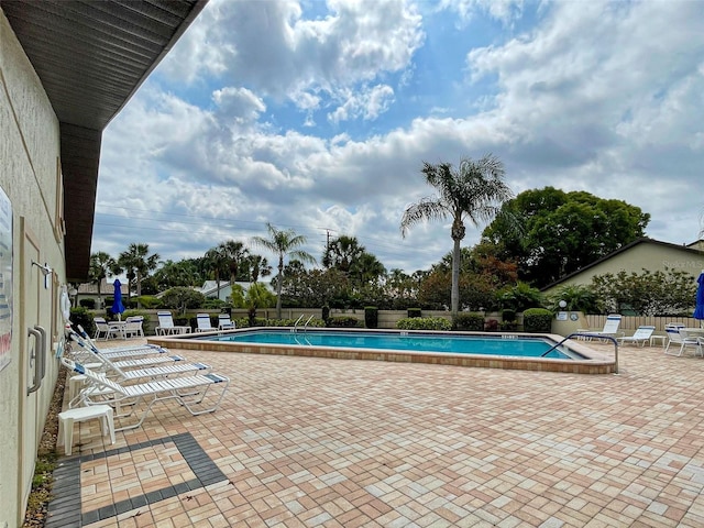 view of pool featuring a patio