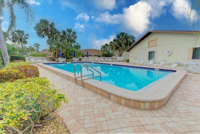 view of swimming pool with a patio area