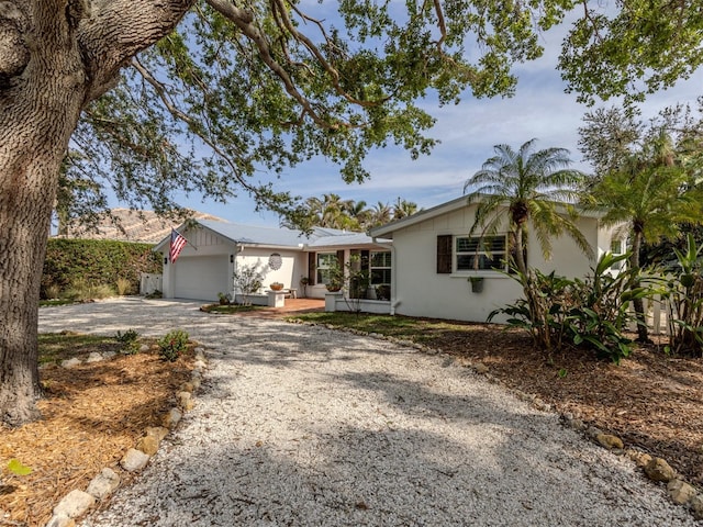 ranch-style house featuring a garage