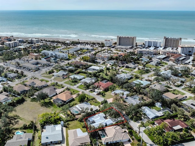 aerial view of property's location with property parcel outlined and unending shoreline