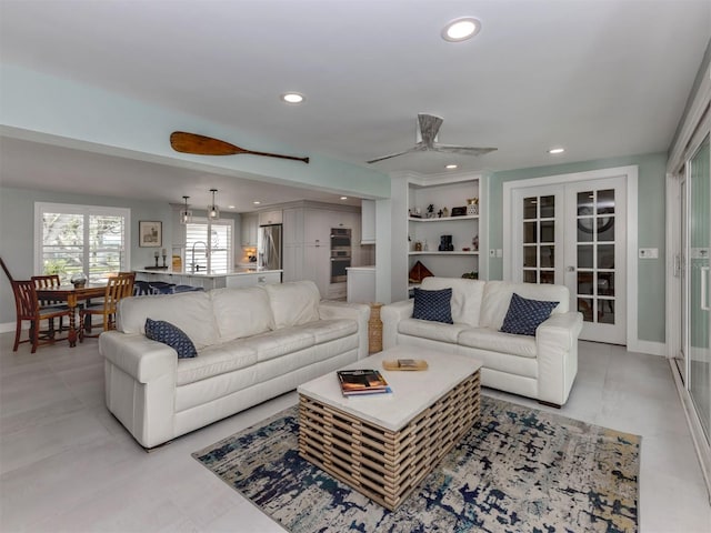 living area featuring recessed lighting, french doors, a ceiling fan, and baseboards