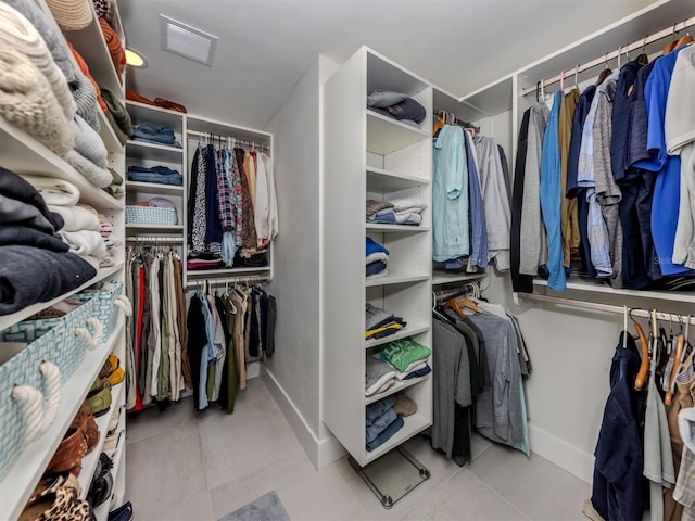 spacious closet featuring tile patterned flooring