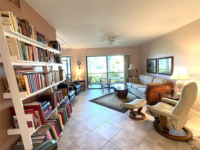 tiled living room featuring ceiling fan