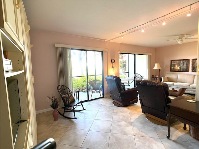 tiled living room featuring ceiling fan