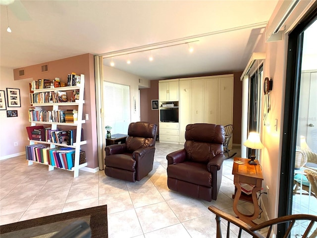 living room with light tile patterned floors