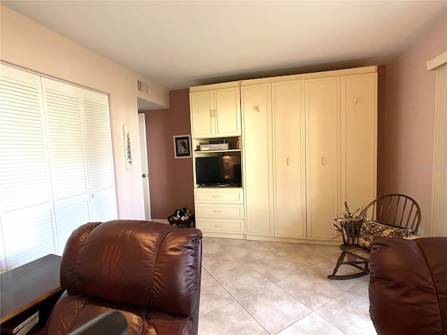 living room featuring light tile patterned flooring