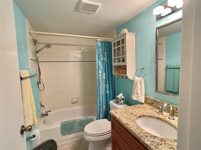 full bathroom featuring shower / bath combo, vanity, a textured ceiling, tile patterned flooring, and toilet