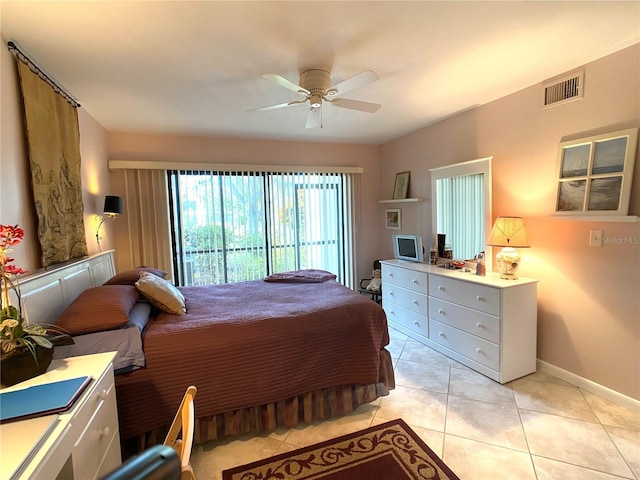 tiled bedroom with ceiling fan