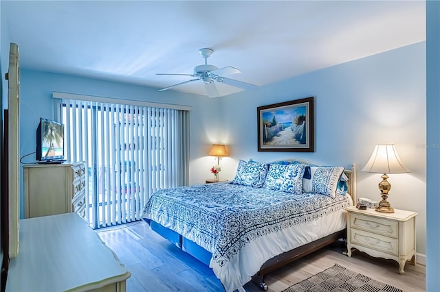 bedroom with ceiling fan and wood-type flooring