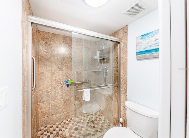 bathroom with toilet and walk in shower