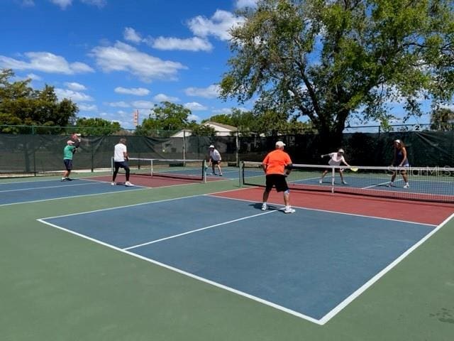 view of sport court featuring basketball hoop