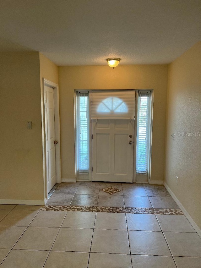 entrance foyer featuring light tile patterned floors