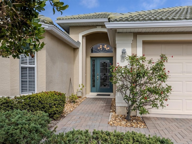 doorway to property featuring a garage