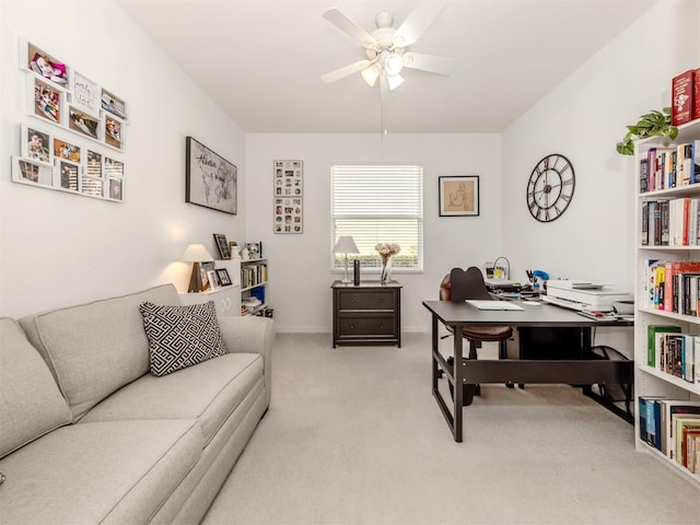 carpeted office featuring ceiling fan