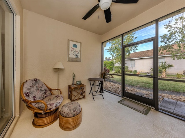 sunroom / solarium with ceiling fan