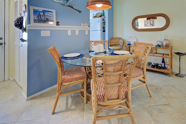 dining room with tile patterned flooring