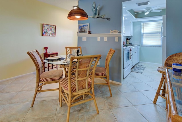 dining area featuring ceiling fan and light tile patterned flooring