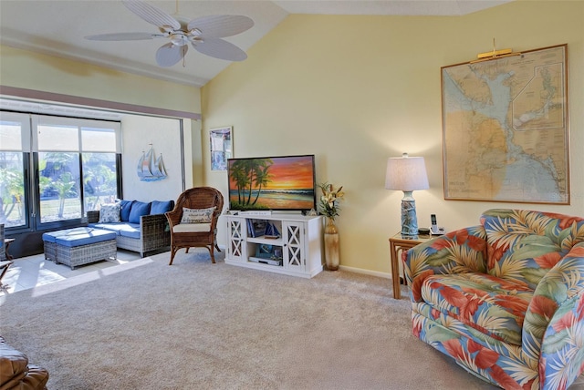 carpeted living room featuring vaulted ceiling and ceiling fan