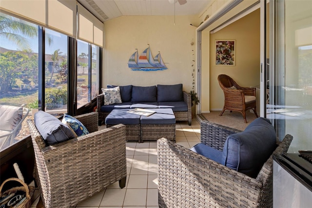 sunroom with ceiling fan and lofted ceiling