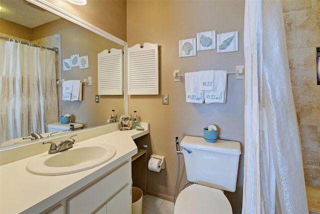 bathroom with vanity, tile patterned flooring, a shower with curtain, and toilet