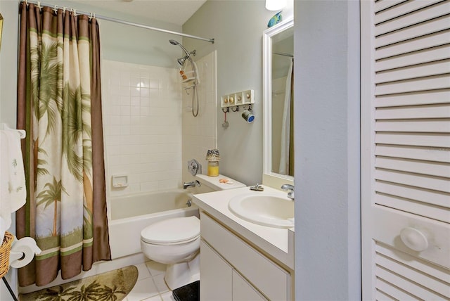 full bathroom featuring tile patterned floors, vanity, toilet, and shower / tub combo