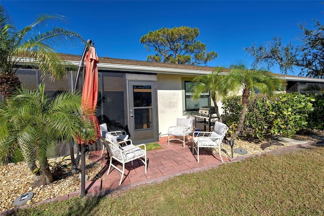 rear view of property featuring a yard and a patio