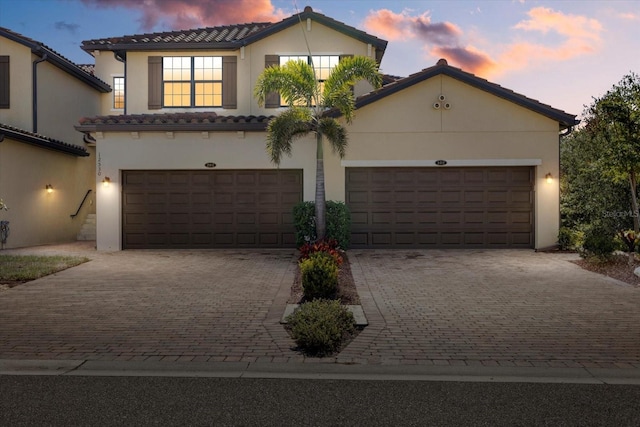 view of front of property with a garage