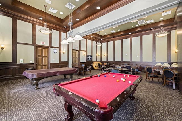 game room with dark colored carpet, a towering ceiling, a raised ceiling, and billiards