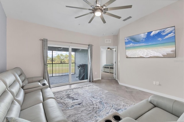 tiled living room featuring ceiling fan