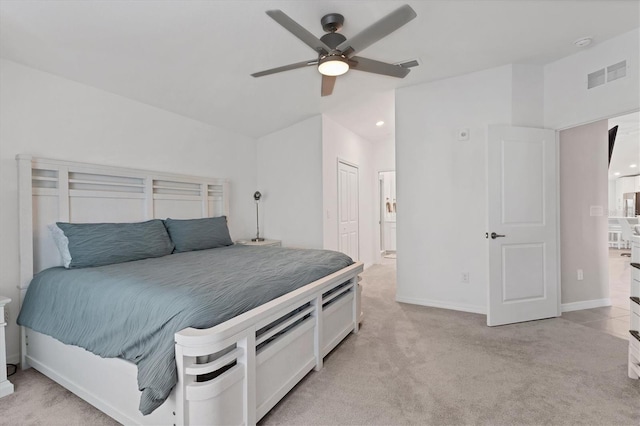 carpeted bedroom featuring ceiling fan and a closet