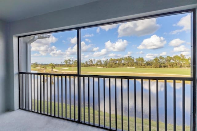 unfurnished sunroom with a water view