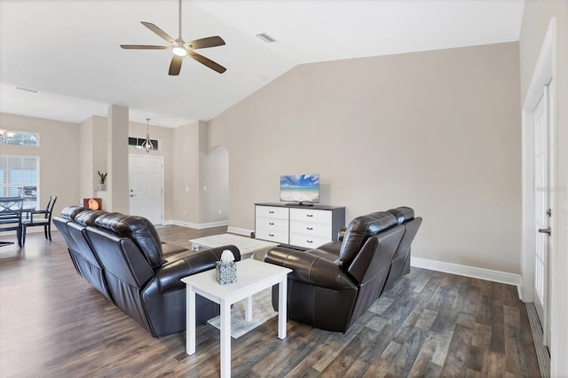 living room with dark hardwood / wood-style flooring, ceiling fan, and lofted ceiling