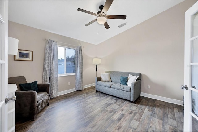 sitting room with ceiling fan and wood-type flooring