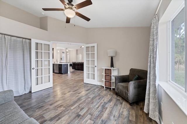 sitting room with ceiling fan, french doors, and dark hardwood / wood-style floors